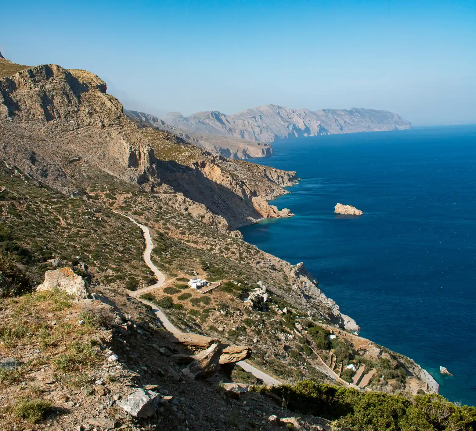 Asphlat road winding on the coastal rocky mountains.