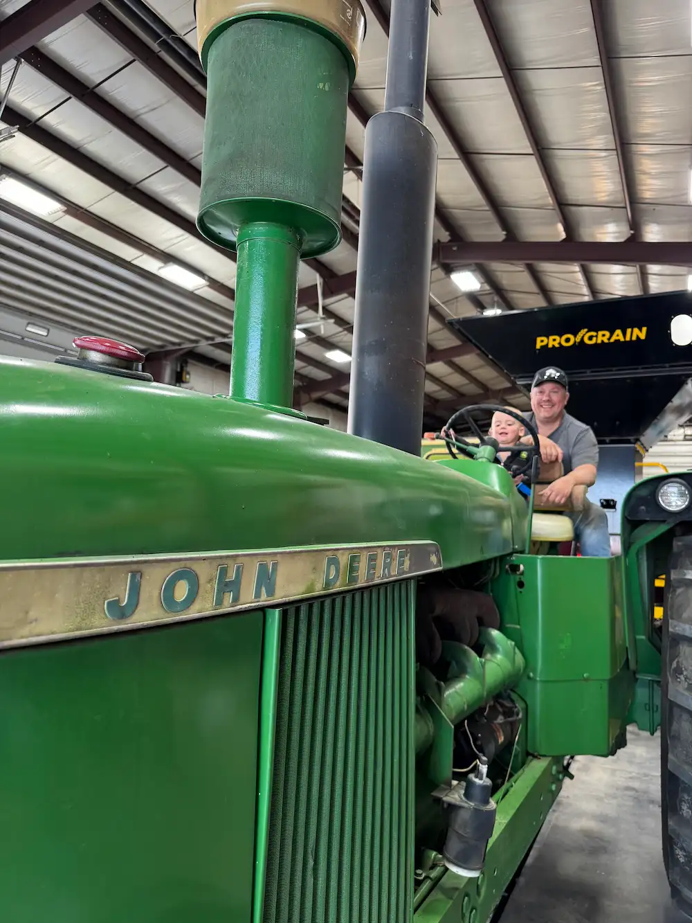 john deer tractor with Thomas Winny and child