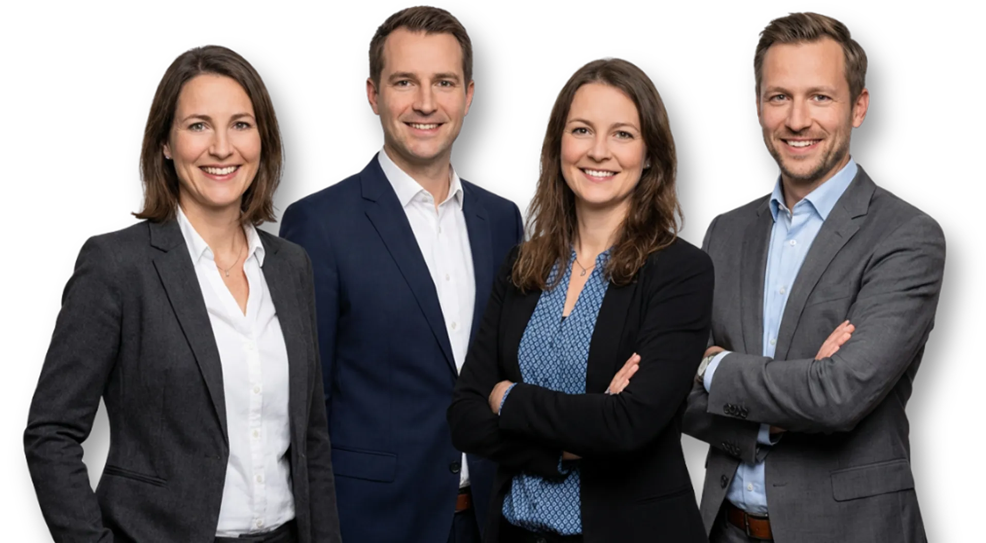 Four professionals wearing business attire smiling against a black background, two women and two men.