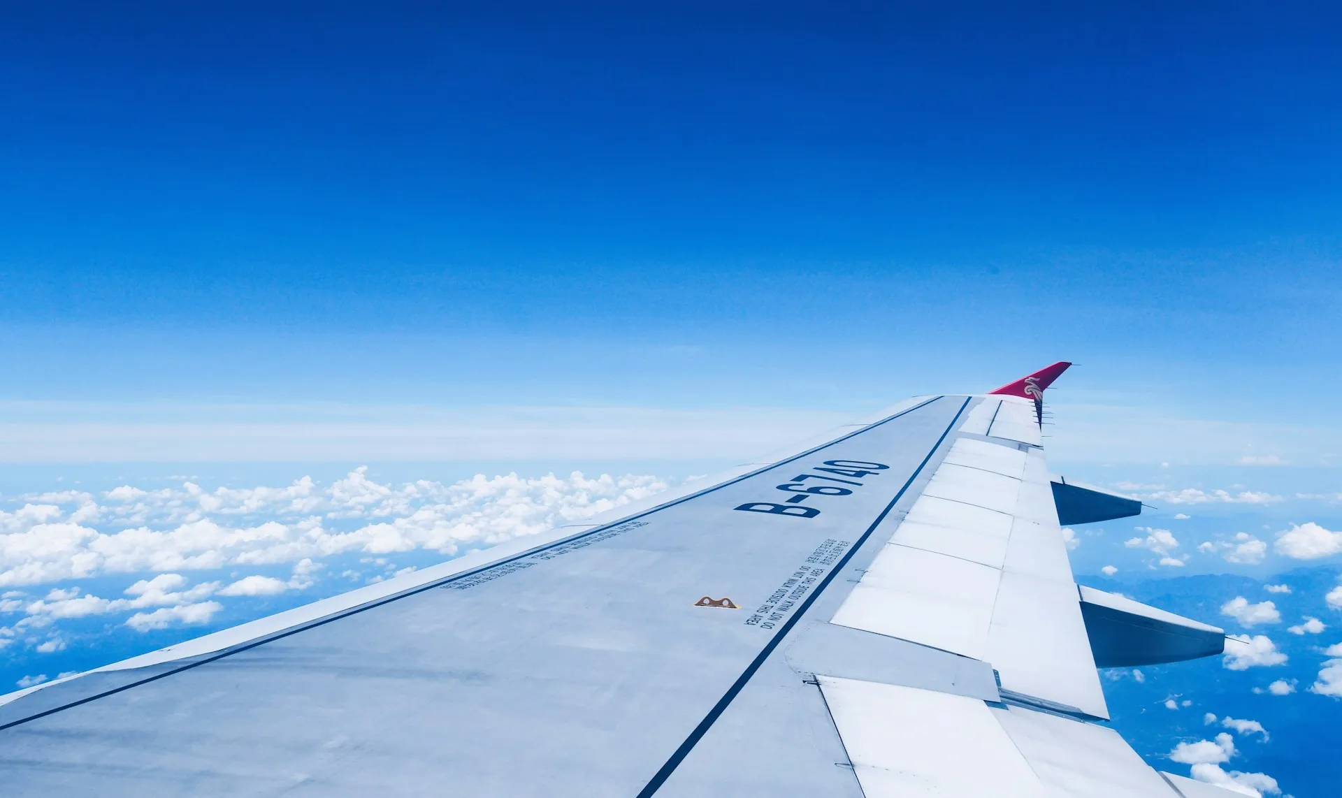 white and blue airplane