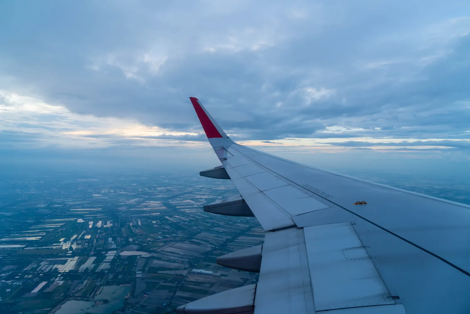 airplane flying clouds