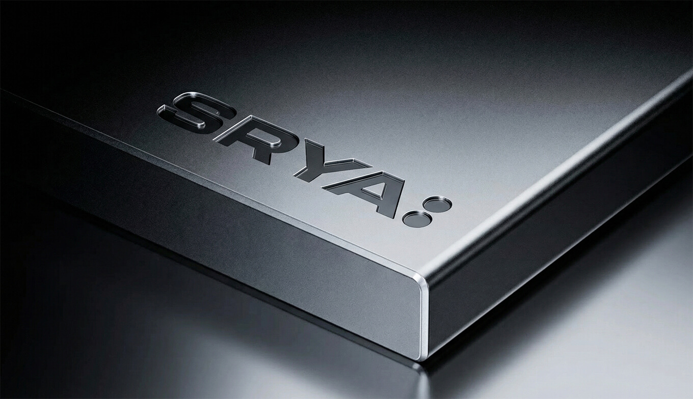 Close-up of sleek metallic corner edge of a product with embossed 'SRYA' branding.