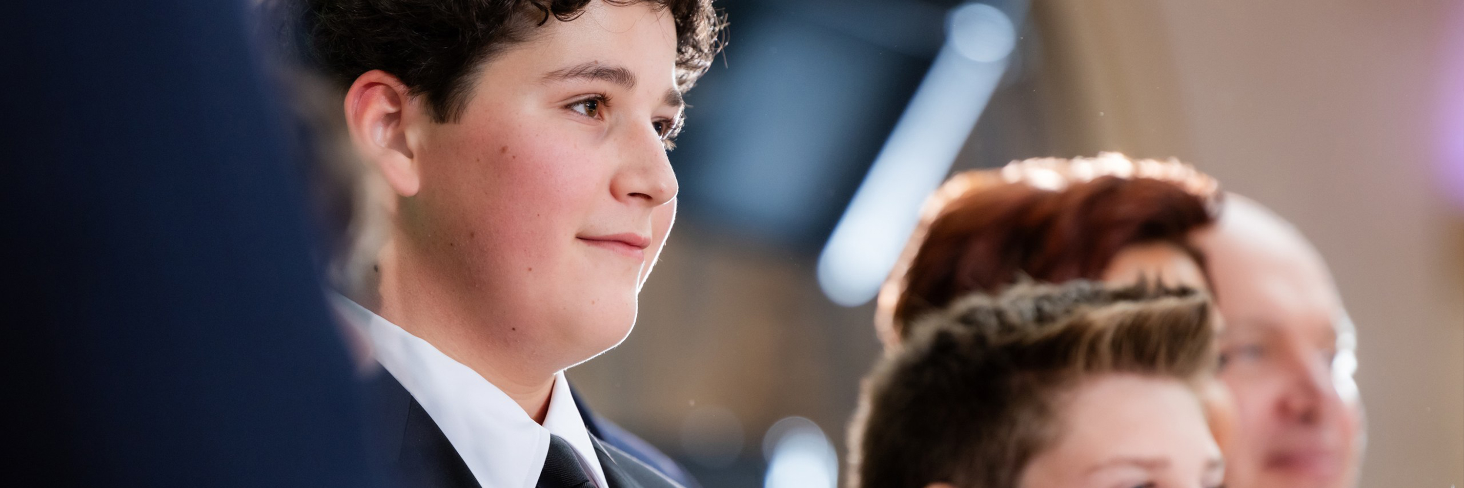 Soft textured cube with gradients of orange, yellow, pink, and light blue on a split orange and light blue background.