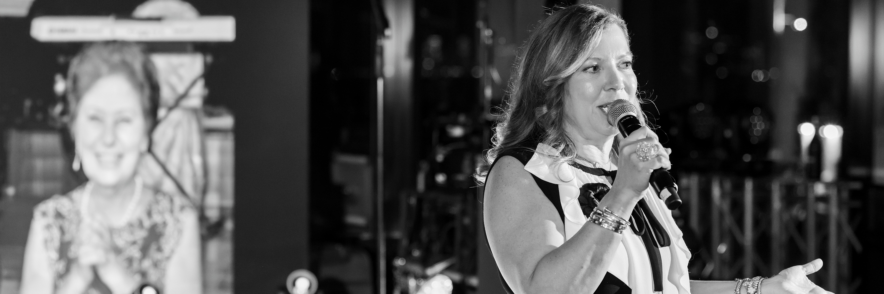 A stack of newspapers floating on clear blue water with a photo of three swimmers on the front page.