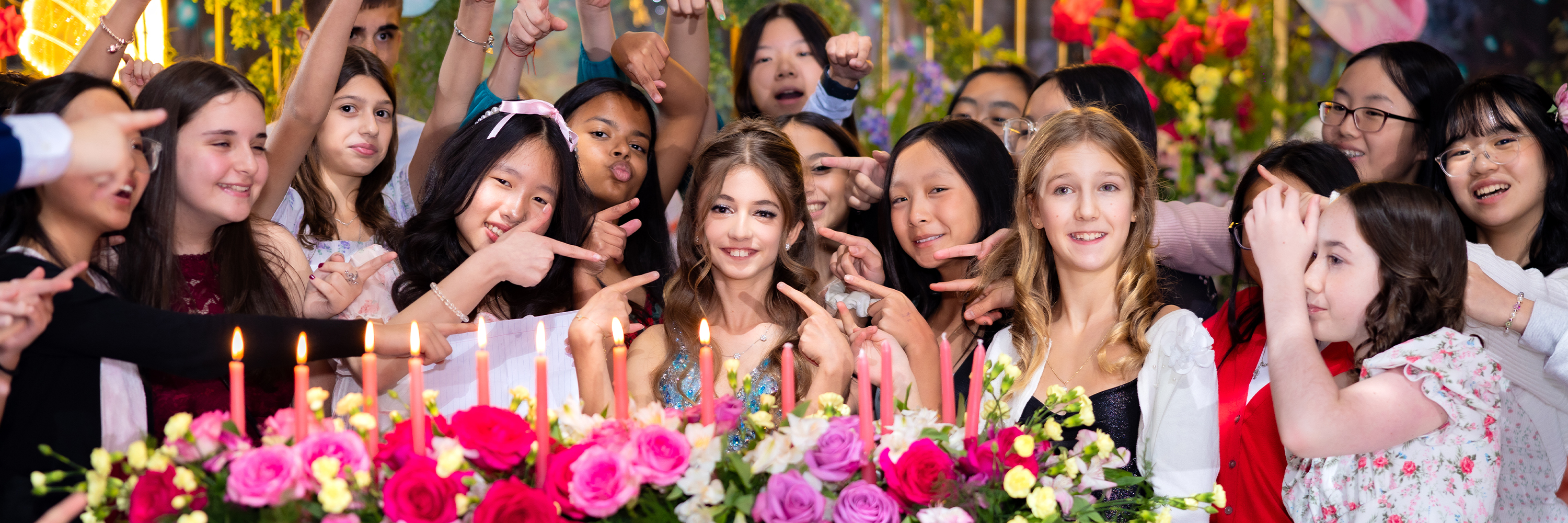 Two small black square-shaped stools casting shadows on a textured green surface.