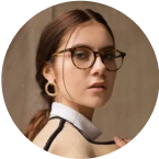 A woman wearing glasses and a white shirt.