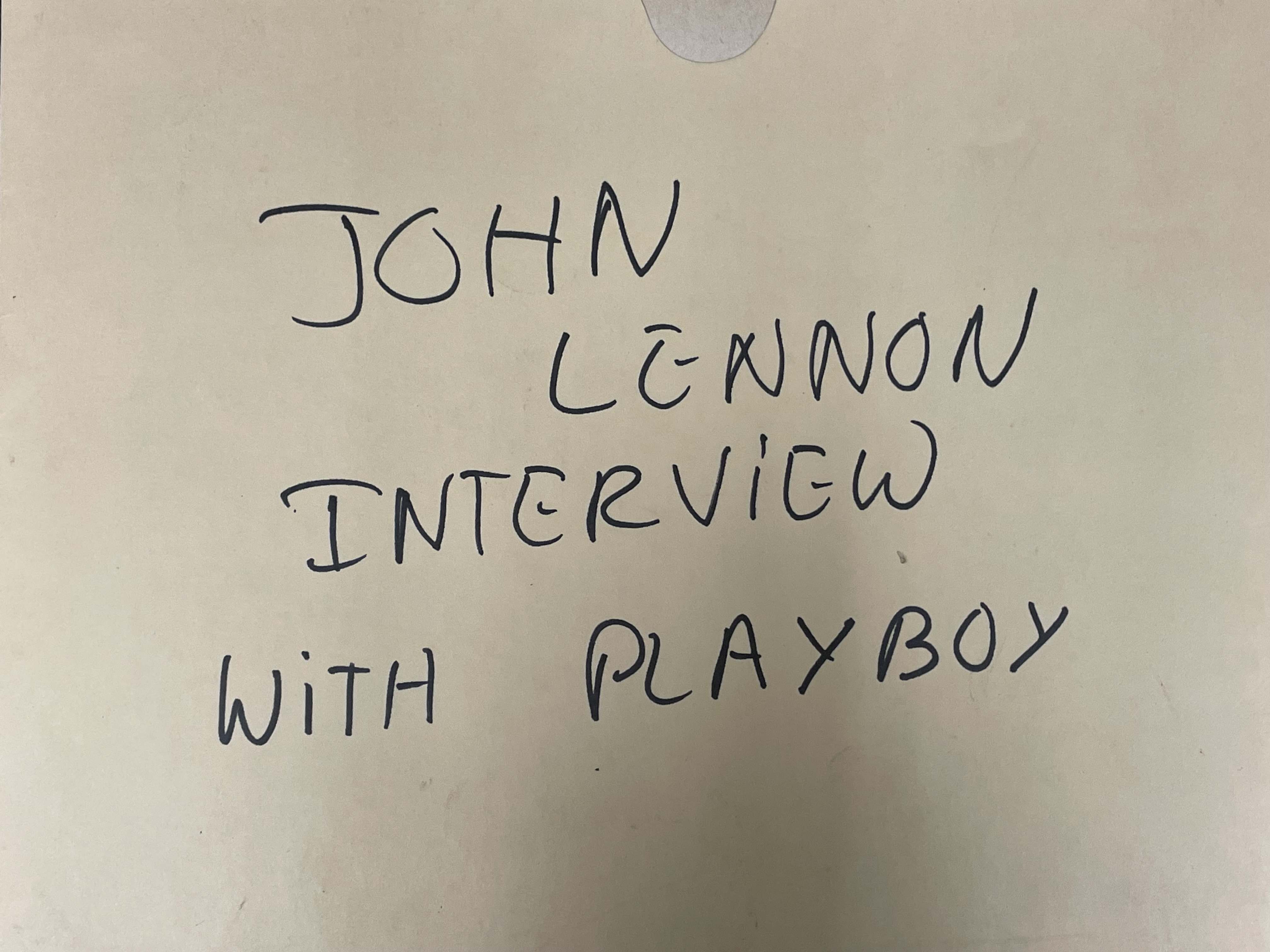 Costume sketch of a clown-like figure with a round beige torso, orange-striped sleeves, oversized purple pants, yellow gloves, and large yellow shoes.