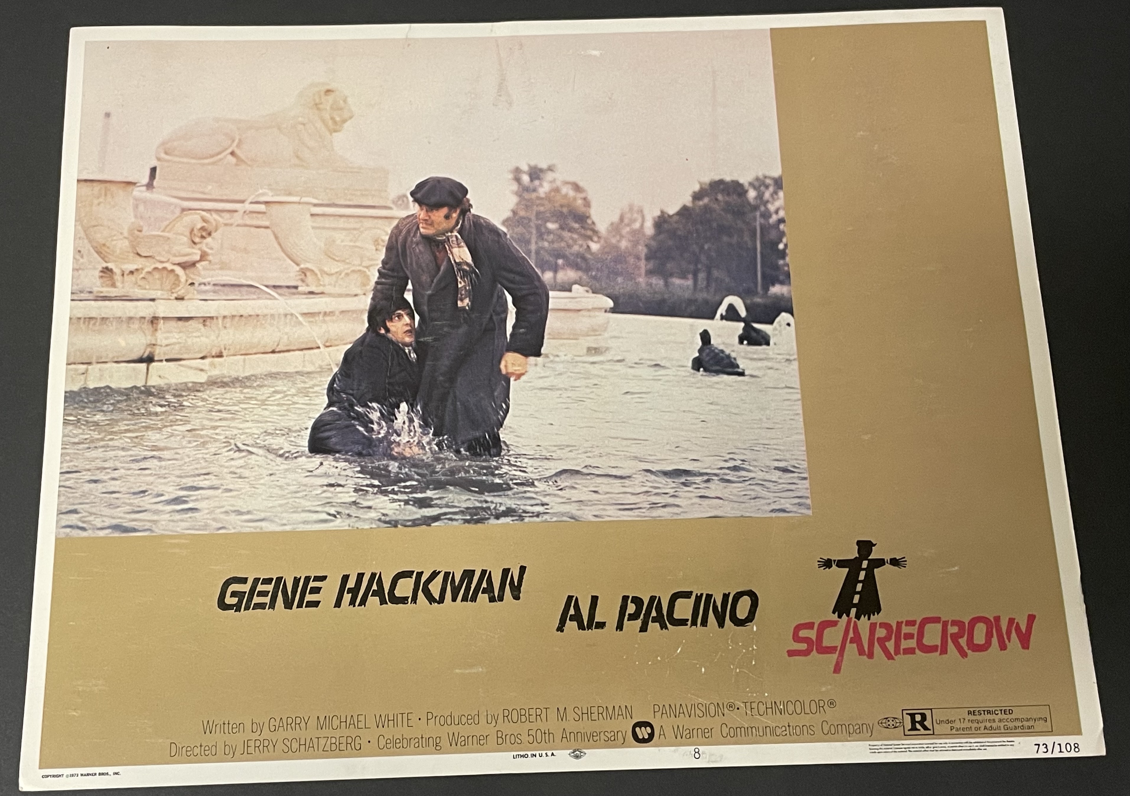 Costume sketch of a clown-like figure with a round beige torso, orange-striped sleeves, oversized purple pants, yellow gloves, and large yellow shoes.