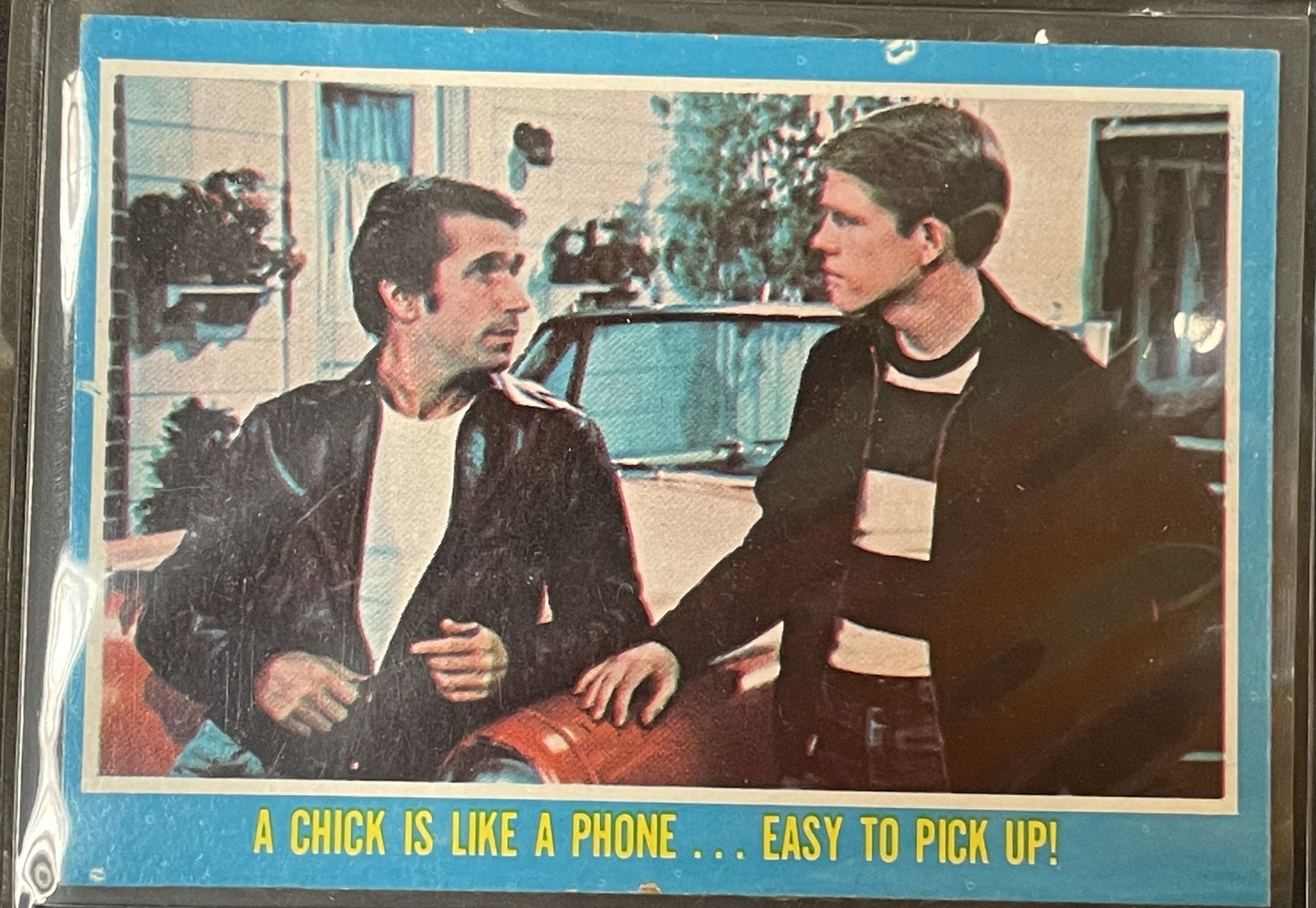 Costume sketch of a clown-like figure with a round beige torso, orange-striped sleeves, oversized purple pants, yellow gloves, and large yellow shoes.