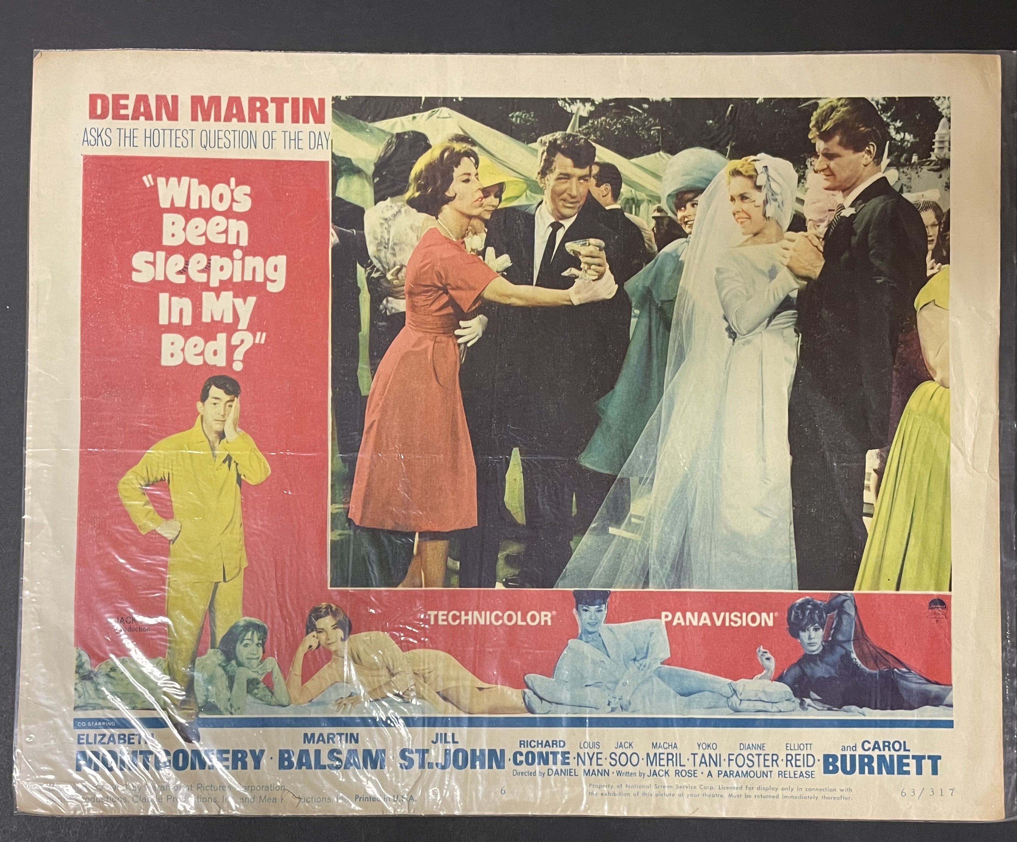 Costume sketch of a clown-like figure with a round beige torso, orange-striped sleeves, oversized purple pants, yellow gloves, and large yellow shoes.