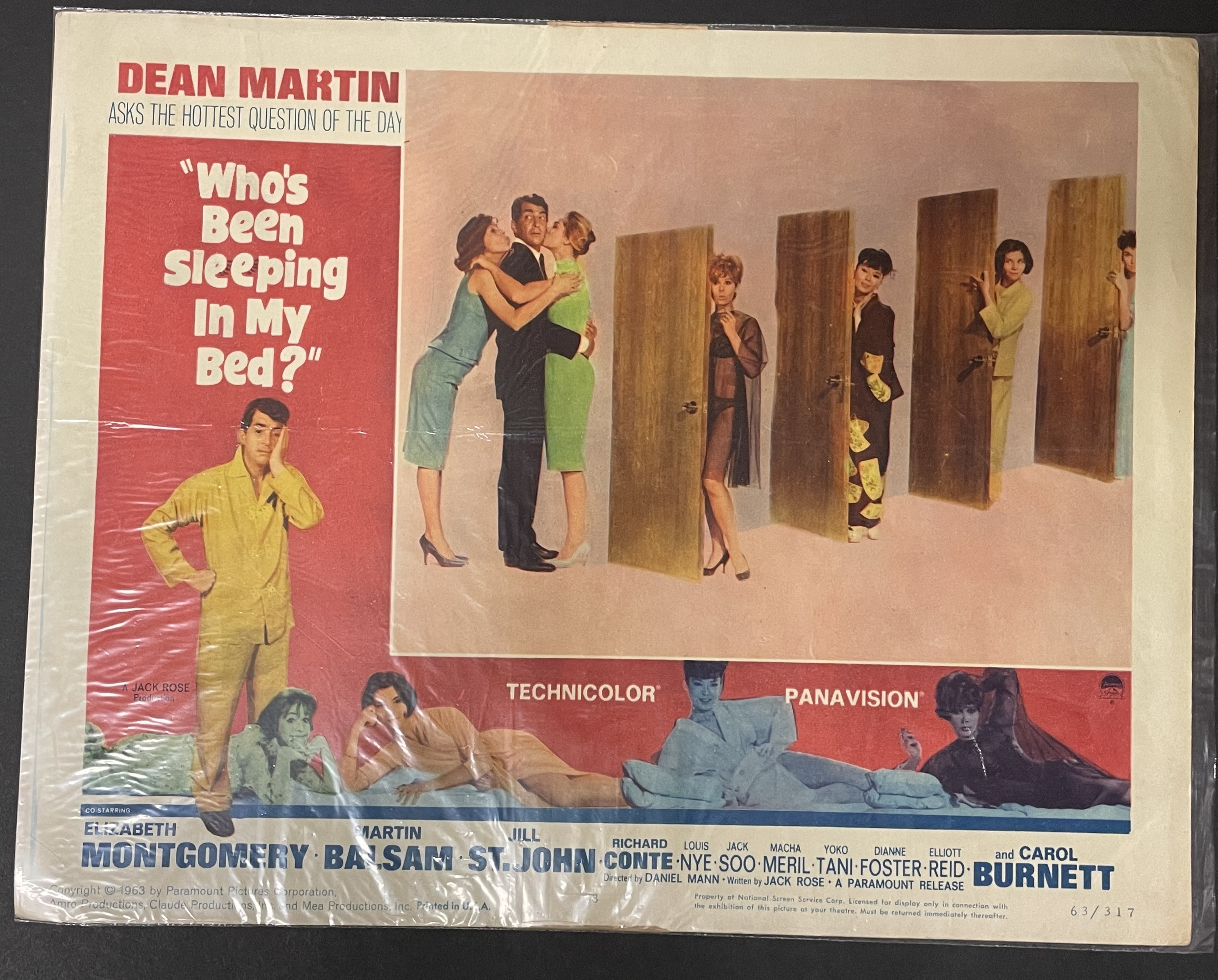 Costume sketch of a clown-like figure with a round beige torso, orange-striped sleeves, oversized purple pants, yellow gloves, and large yellow shoes.