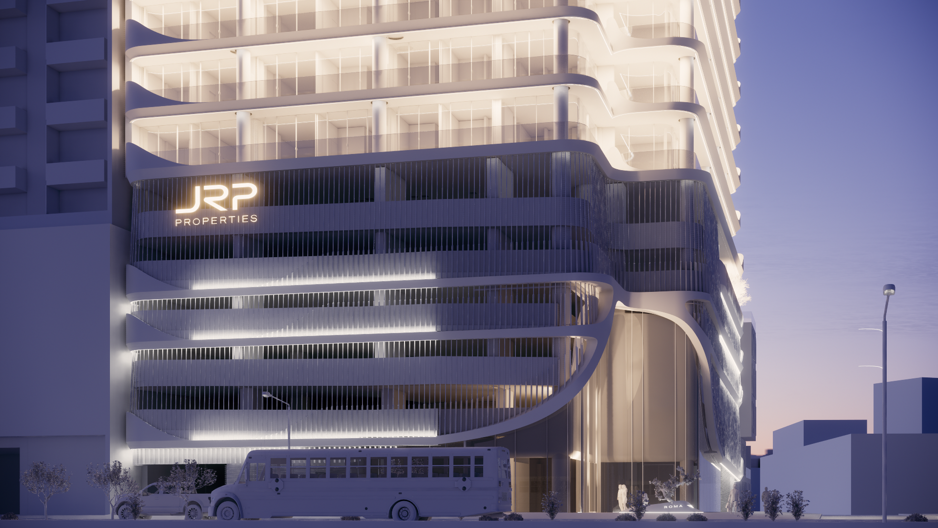 Modern, illuminated multi-story building with curved balconies at dusk, featuring a JRP Properties sign and parked vehicles in front.