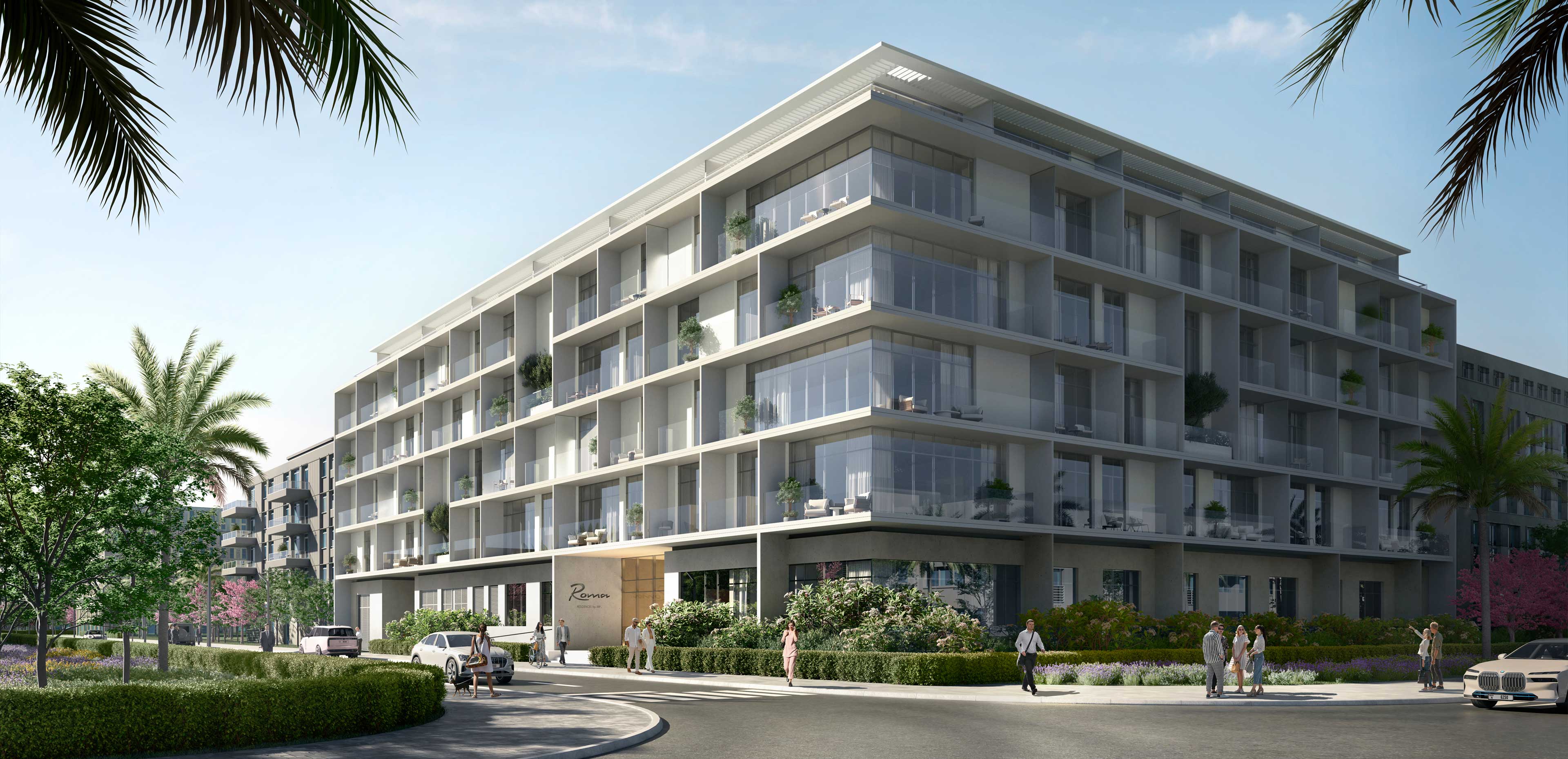 Modern four-story apartment building with large glass balconies surrounded by greenery and palm trees under a clear sky.