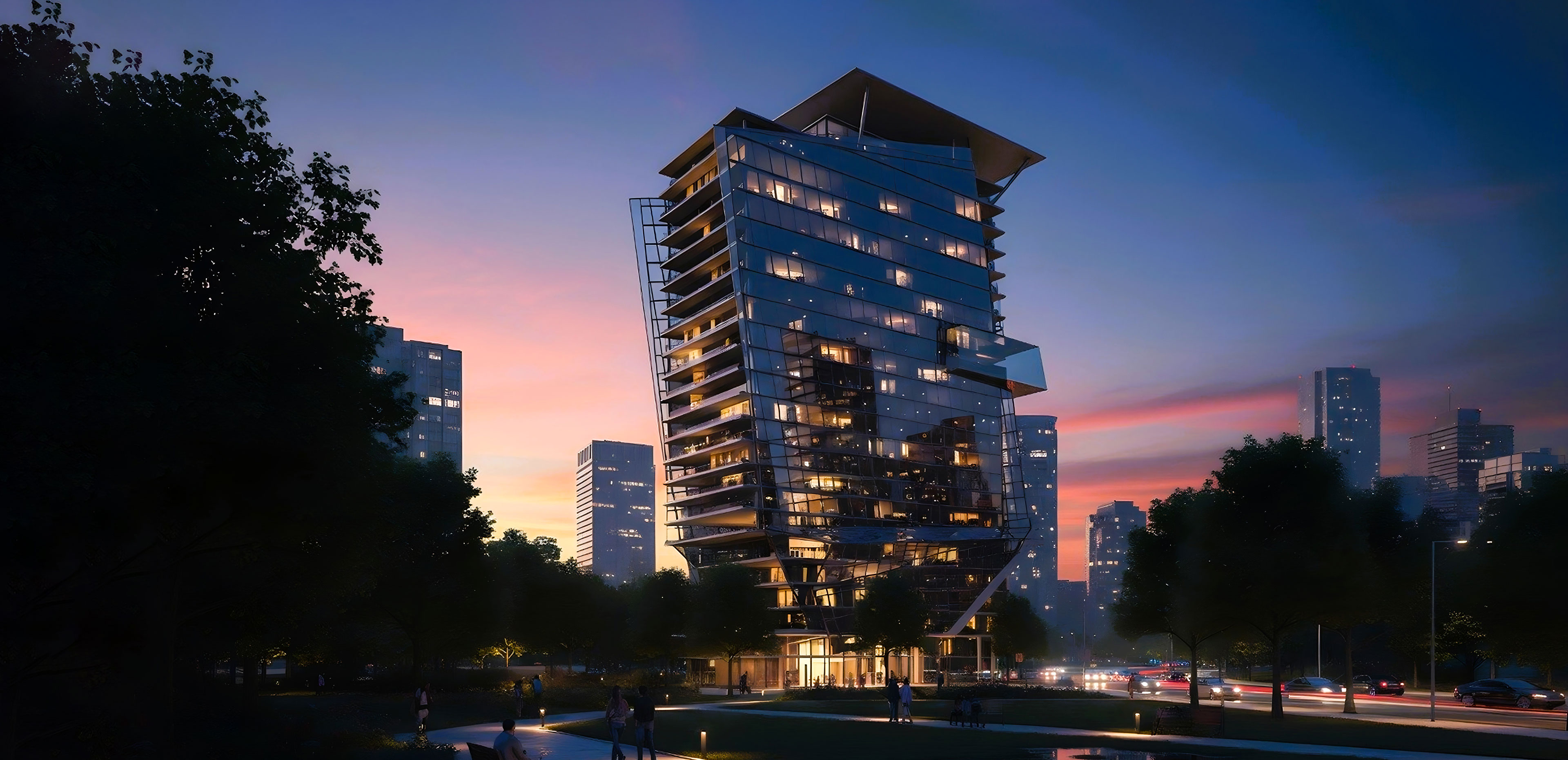 Modern glass high-rise building illuminated at dusk with a city skyline and trees surrounding it.