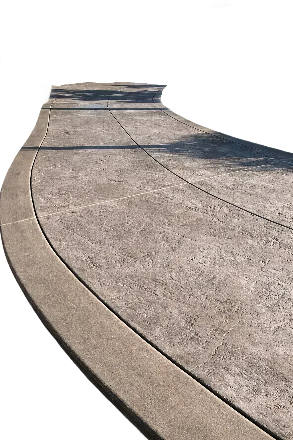 Curved decorative concrete driveway with textured surface and expansion joints.