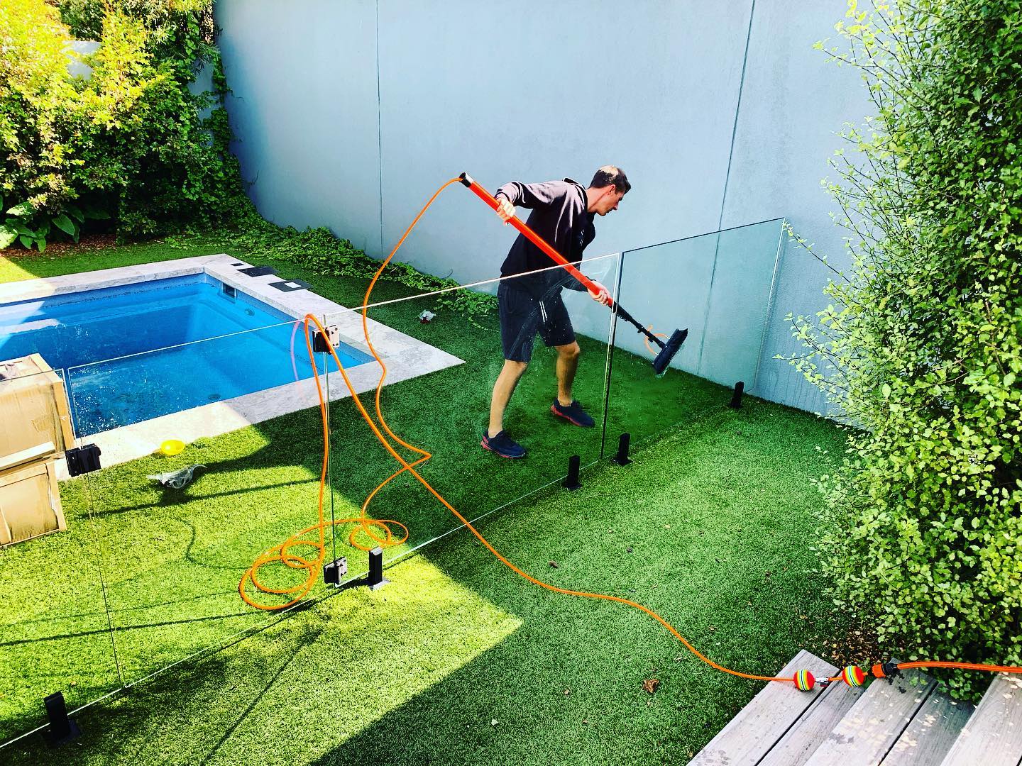 image of team in front of company building (for a roofing contractor)