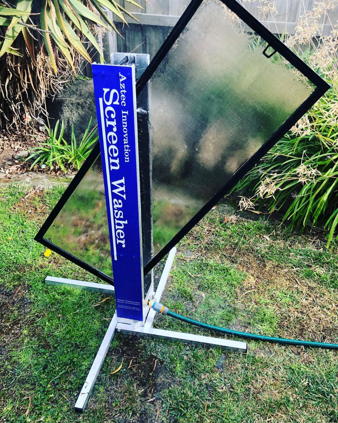 image of team in front of company building (for a roofing contractor)