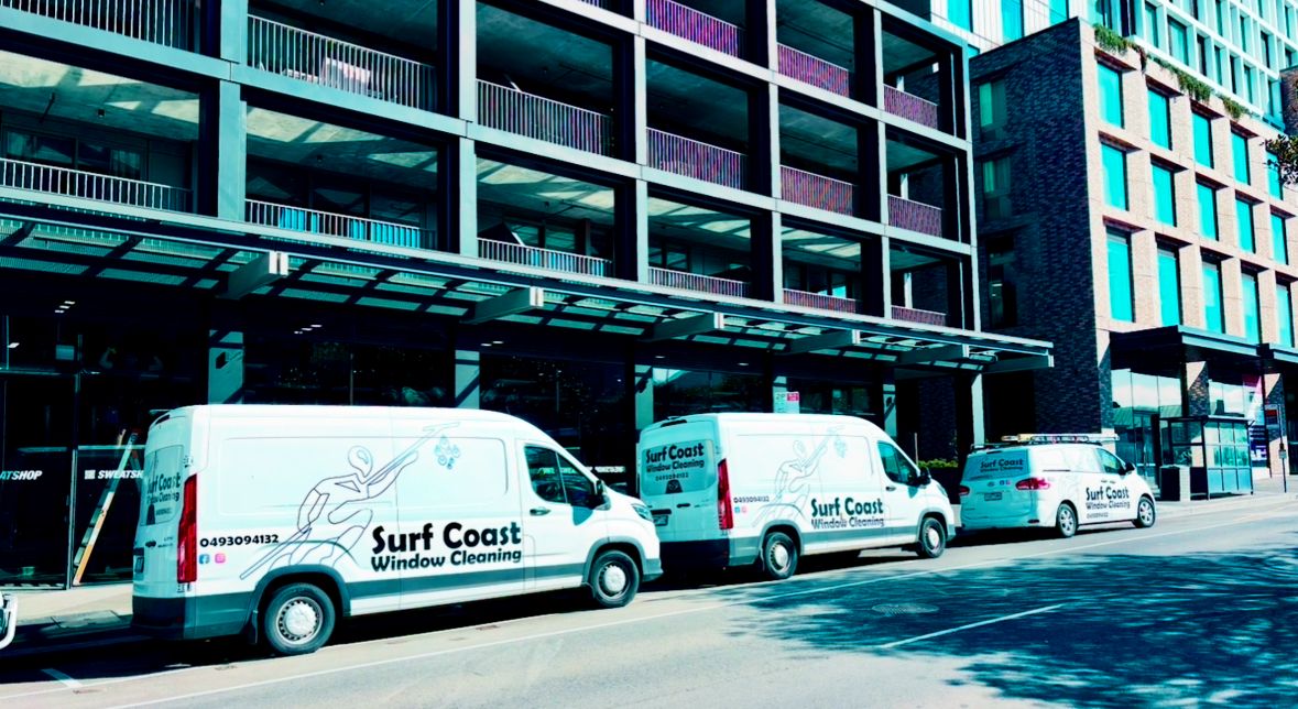 image of team in front of company building (for a roofing contractor)