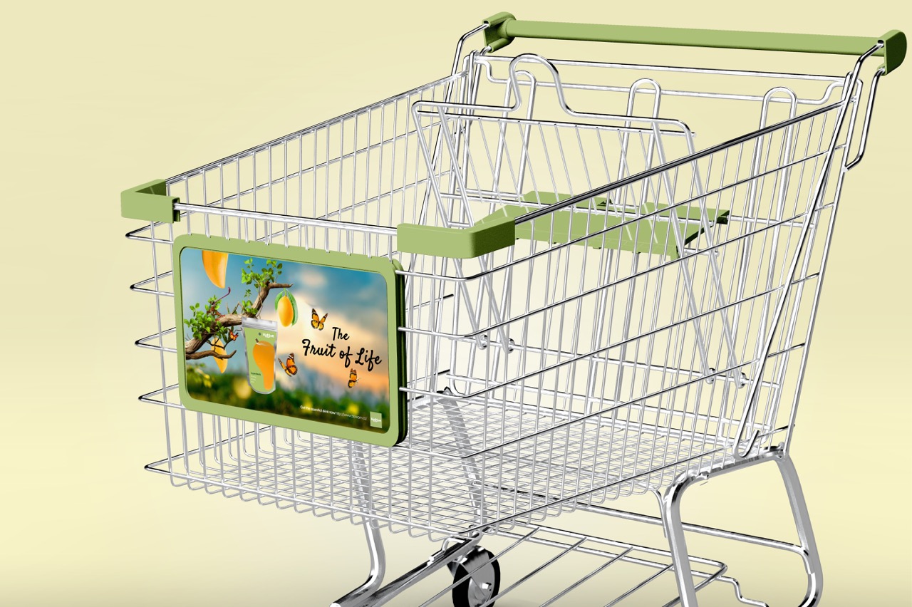 Branded metal shopping cart with green handles and displaying 'The Fruit of Life' advertisement panel