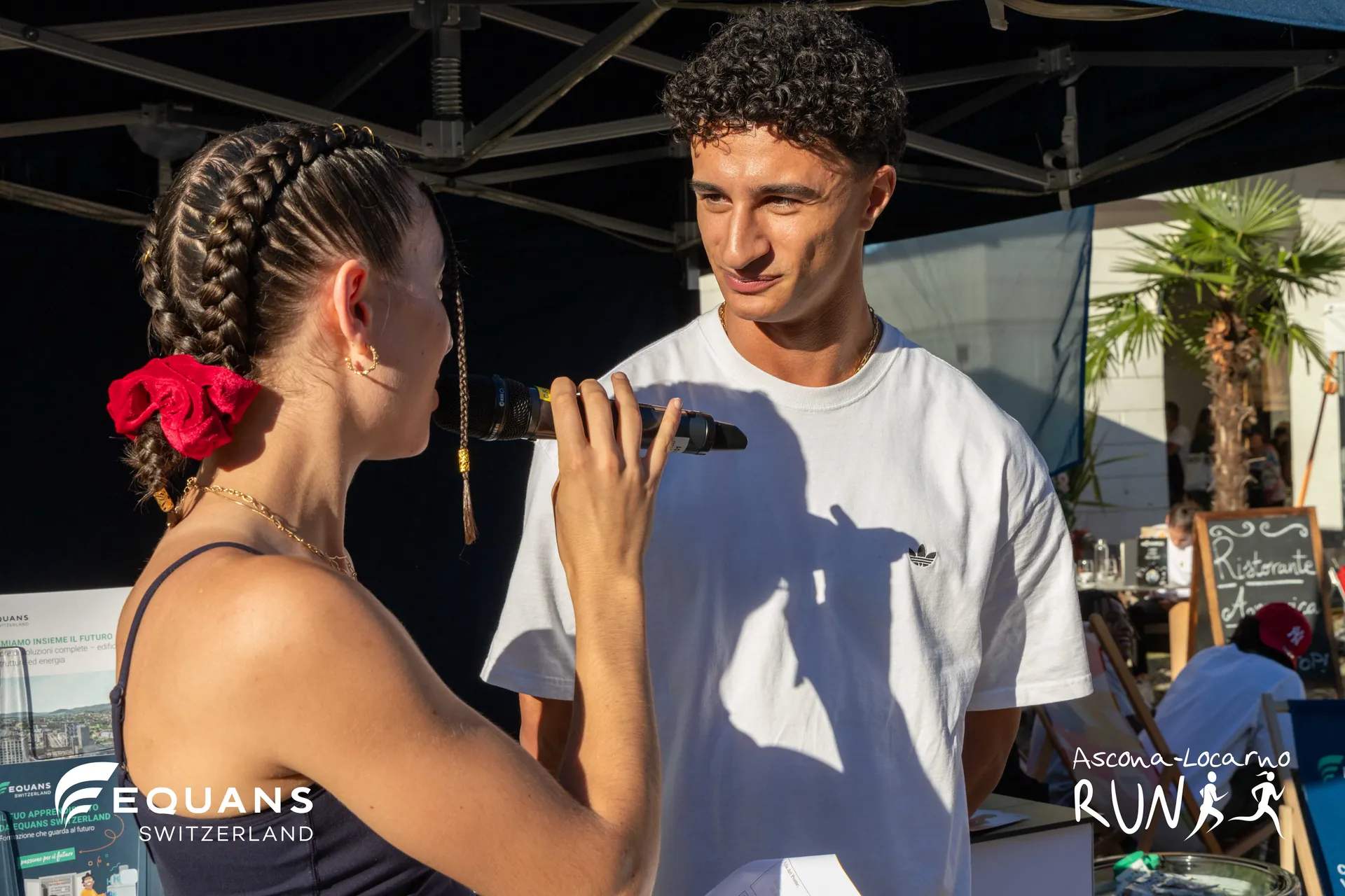 Ladina Ziani interviewing an athlete at the Ascona-Locarno Run