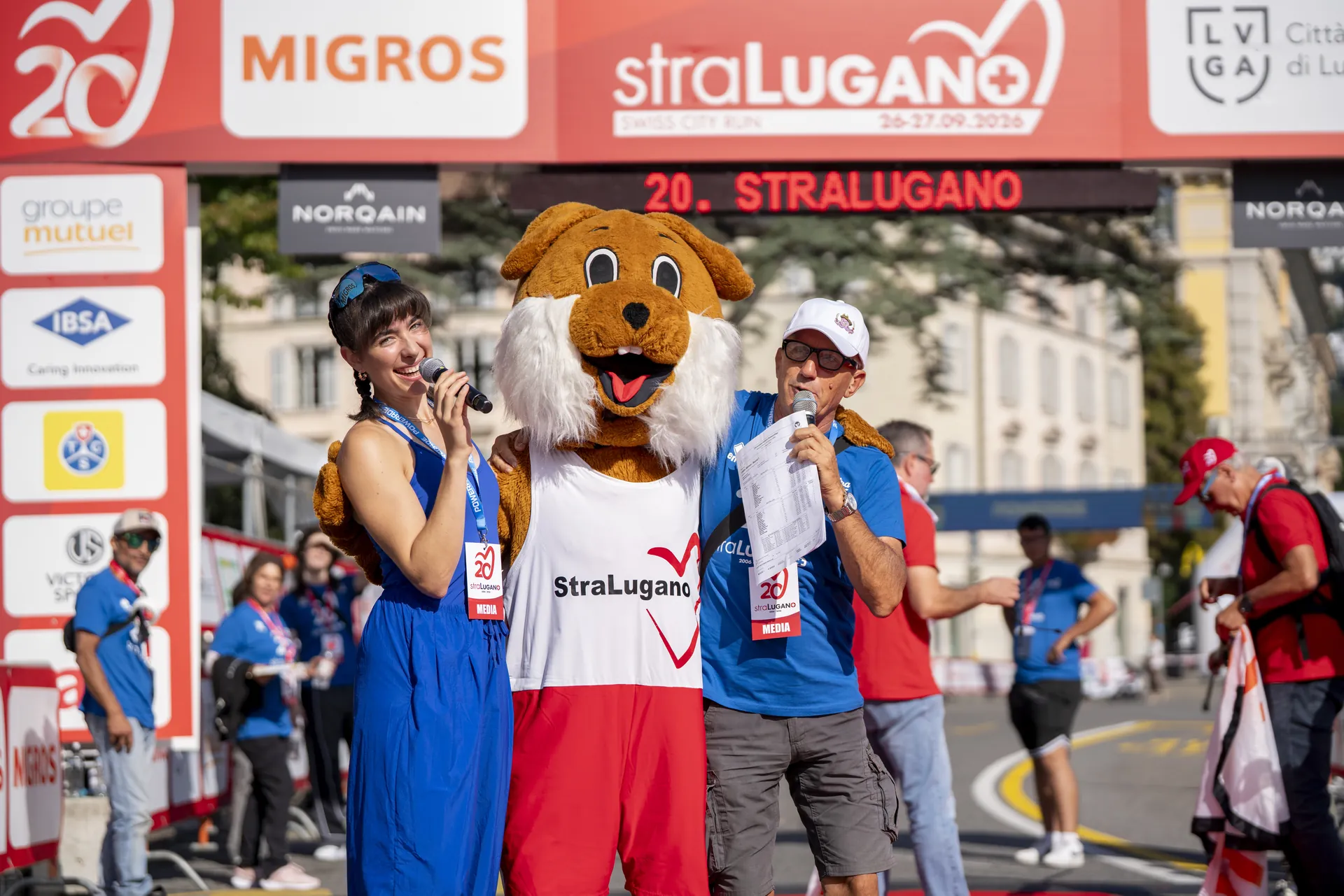Ladina Ziani on stage with the StraLugano mascot at the 20th StraLugano