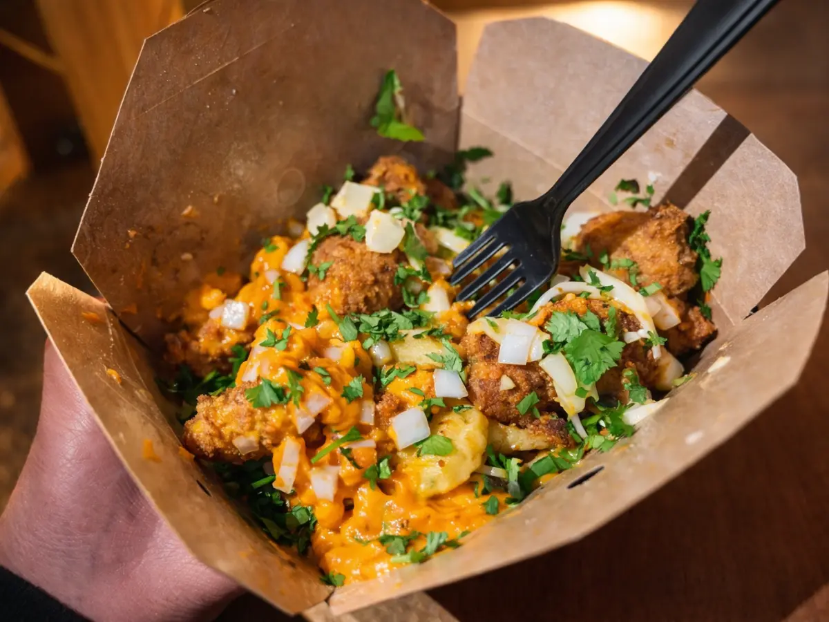 London style fish and chips box with dessert gold and mayo sauces at CHIPZ London Cairo