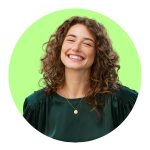 Man with dark hair and beard wearing a black jacket against a bright green circular background.