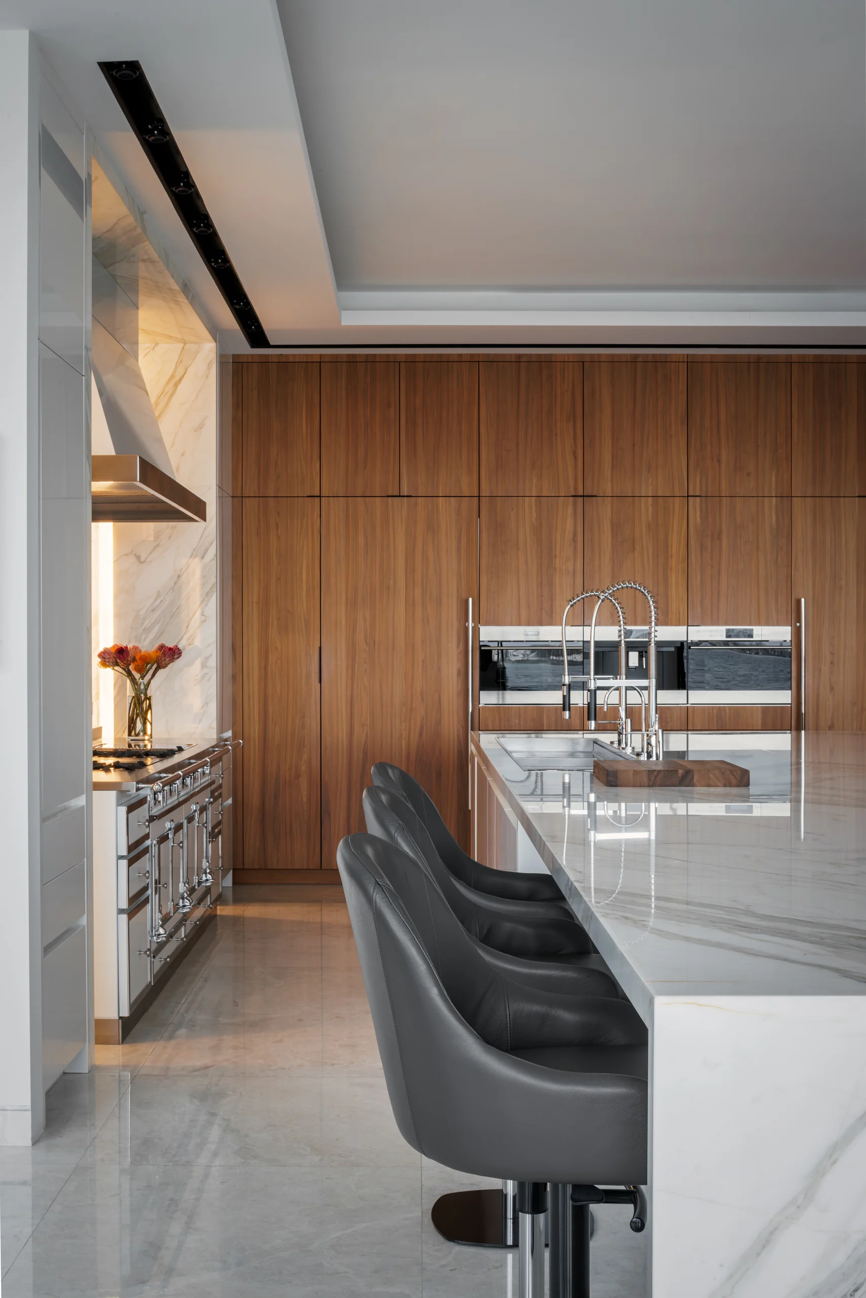 Secondary catering kitchen with a walnut cabinetry wall and a professional range, San Marino Gallery project by Dunagan Design.