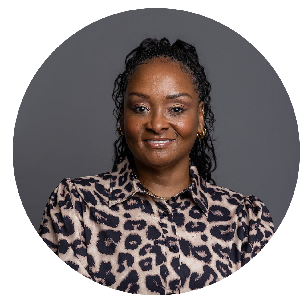 LaKesha Malone, Sr. Director of Housing & Recruitment. Photo shows a smiling woman with braided hair wearing gold hoop earrings and a leopard print button-up blouse, against a plain gray background.
