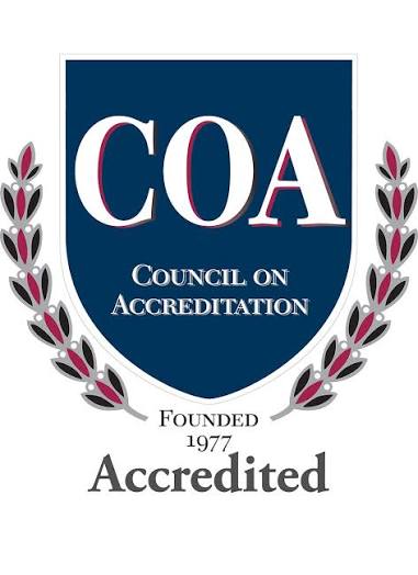 COA Council on Accreditation emblem with laurel branches on each side and text reading 'Founded 1977 Accredited' below the shield.