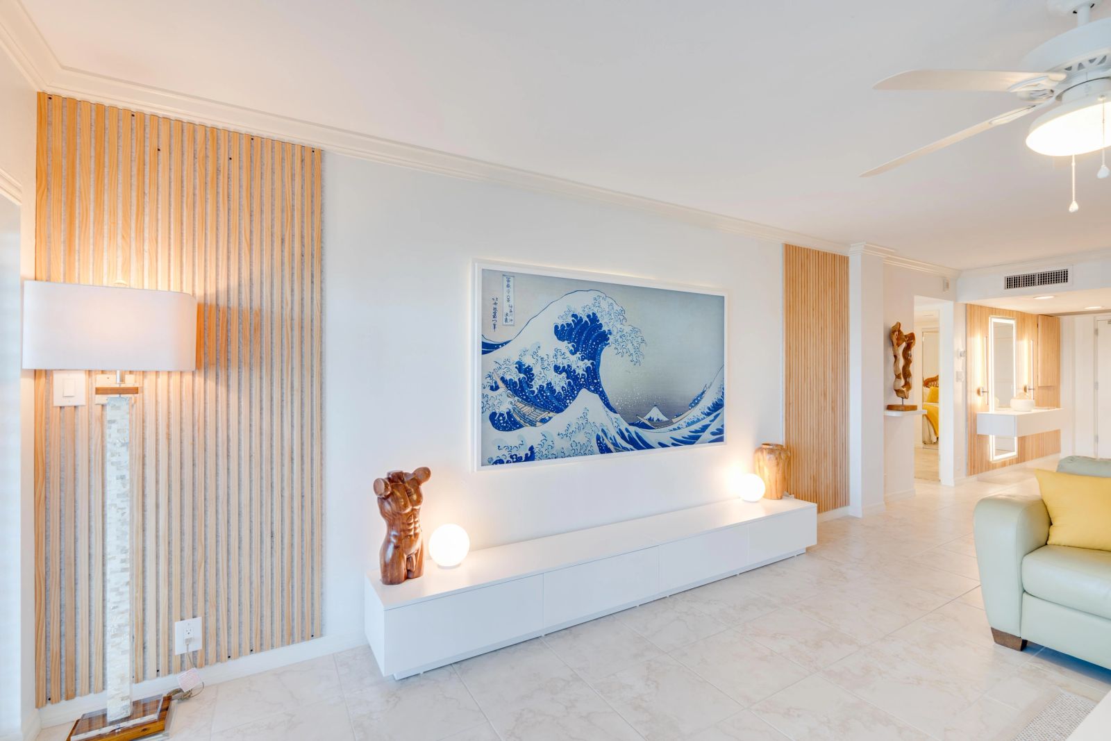 Living room with timber detailing and framed wave artwork