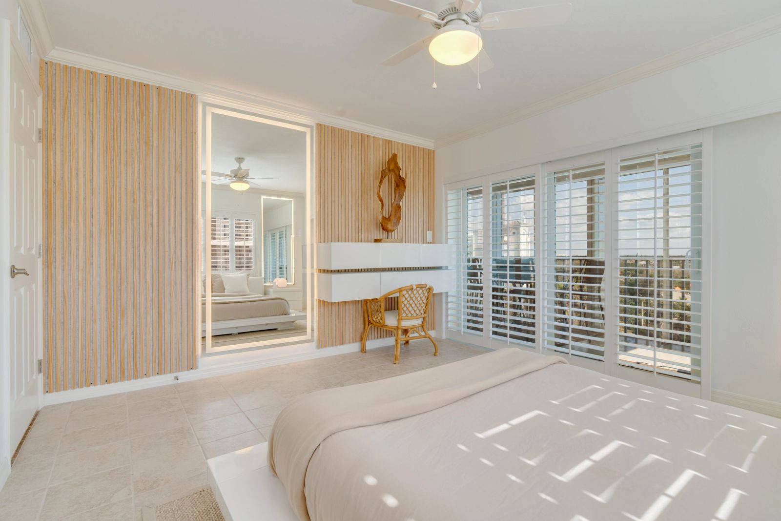 Bright bedroom with timber detailing and plantation shutters
