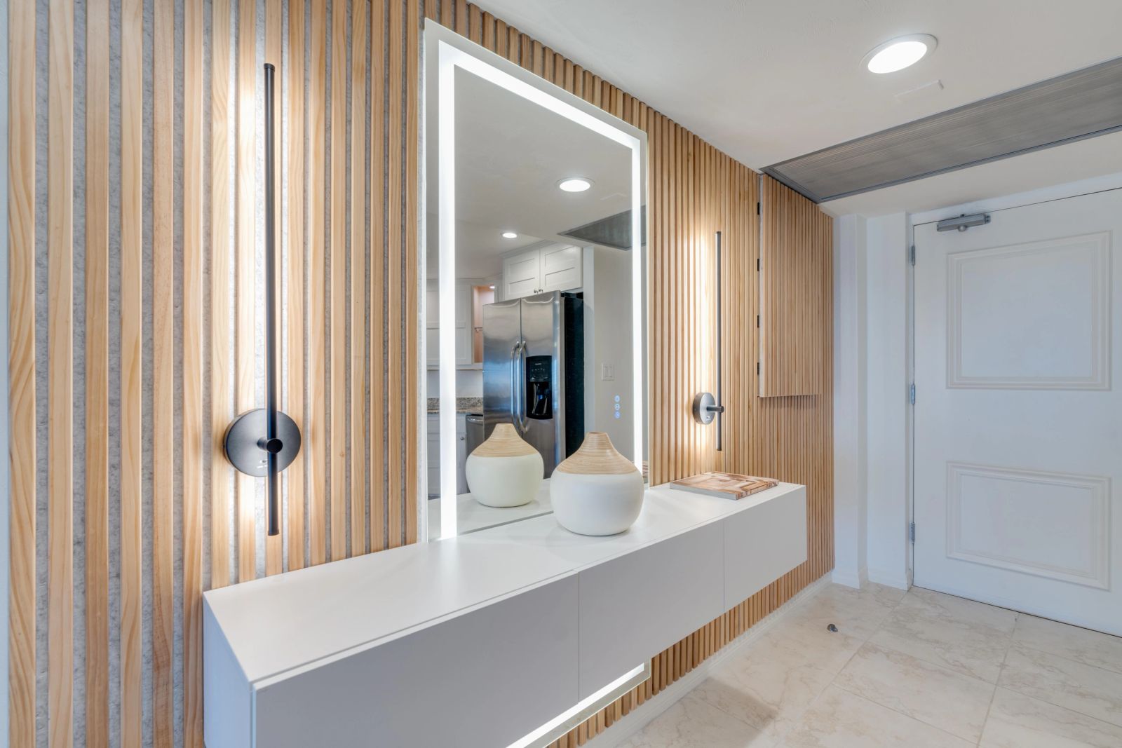 Mirror and floating vanity beside timber slats