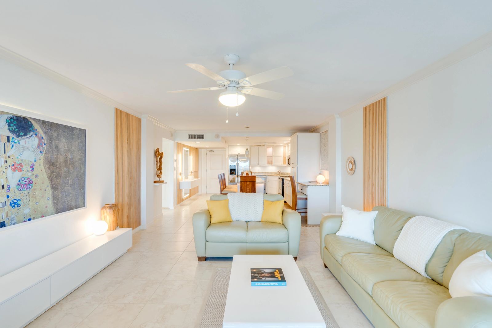 Open living space with art, seating and a dining area