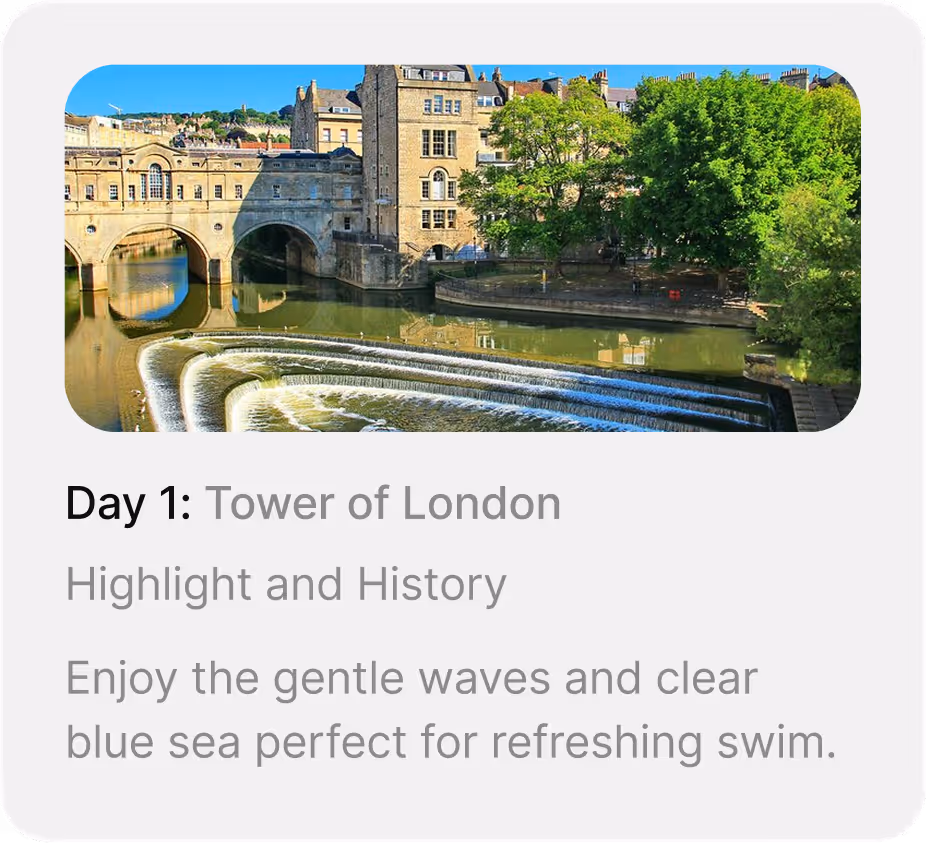 Historic stone bridge over river with cascading stepped weir and reflections of buildings and trees.