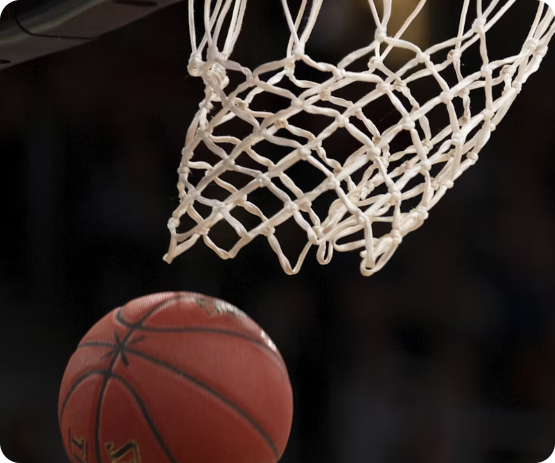 a basketball going through the hoop and falling out