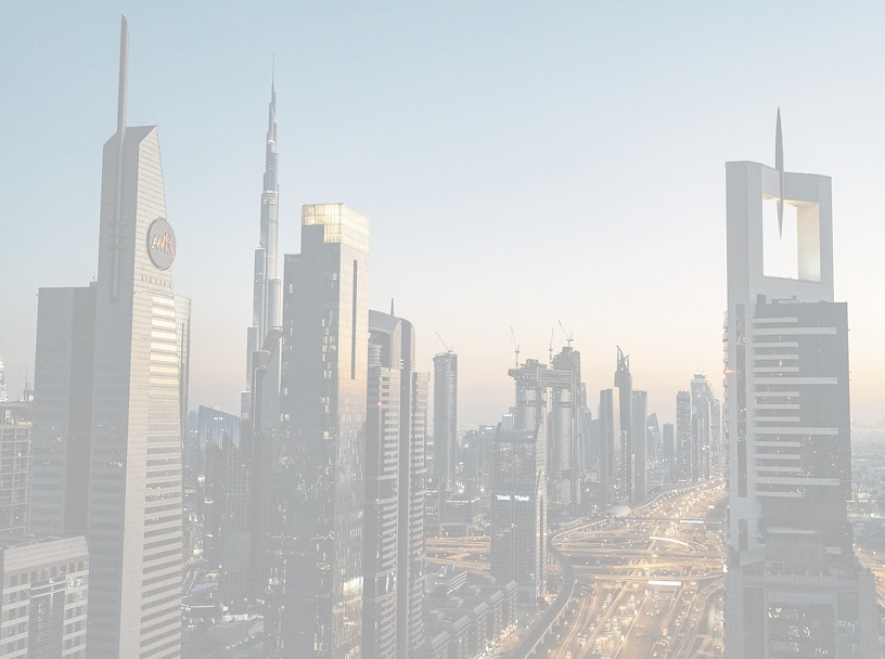 Cityscape of Dubai at dusk featuring Burj Khalifa and illuminated highways surrounded by skyscrapers.