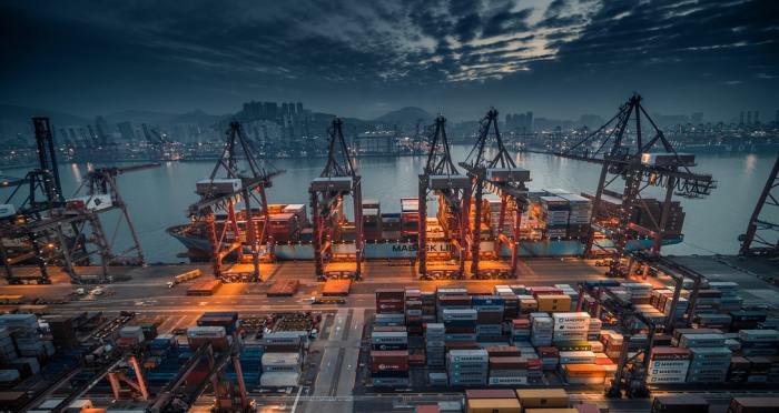 containers being loaded onto a ship