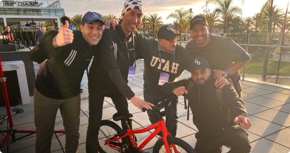 After a successful test ride, this team proudly shows off their bike.