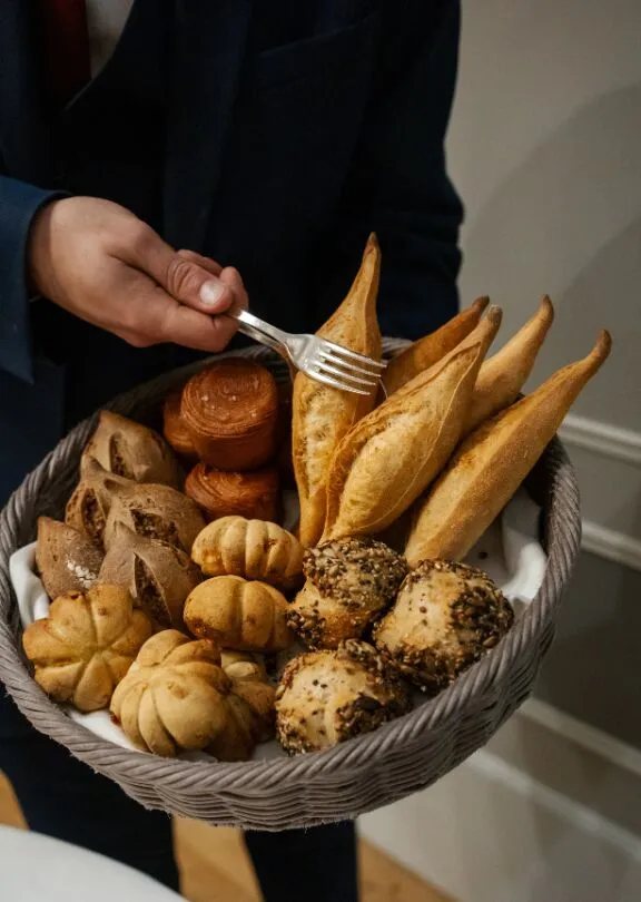 Basket of handmade breads at the restaurant Le Cèdre Beaune in Burgundy.