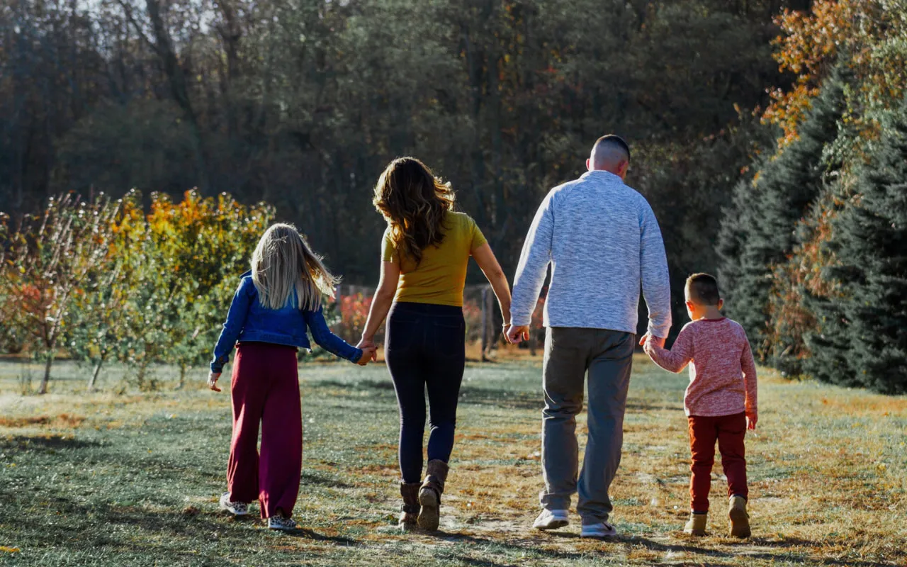 Family taking a walk in nature during an outdoor stroll.