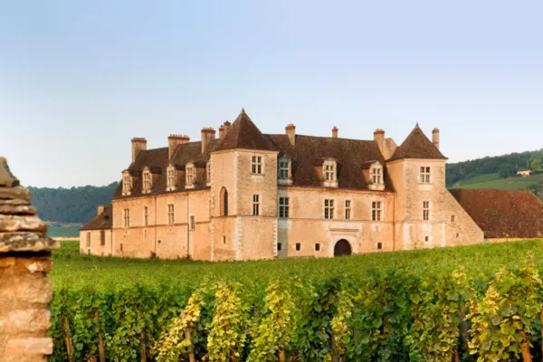 Château du Clos de Vougeot surrounded by vineyards in the Burgundy wine region.