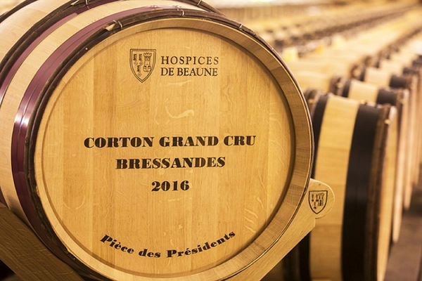 Corton Grand Cru wine barrel in the cellars of the Hospices de Beaune during the Hospices de Beaune Wine Auction.