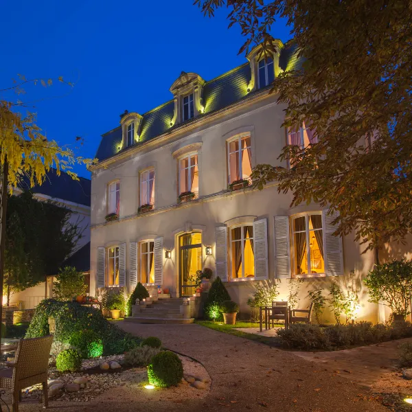 Night view of the facade of the Hostellerie Cèdre & Spa in Beaune, owned by the Beauvallon Collection group in Burgundy.
