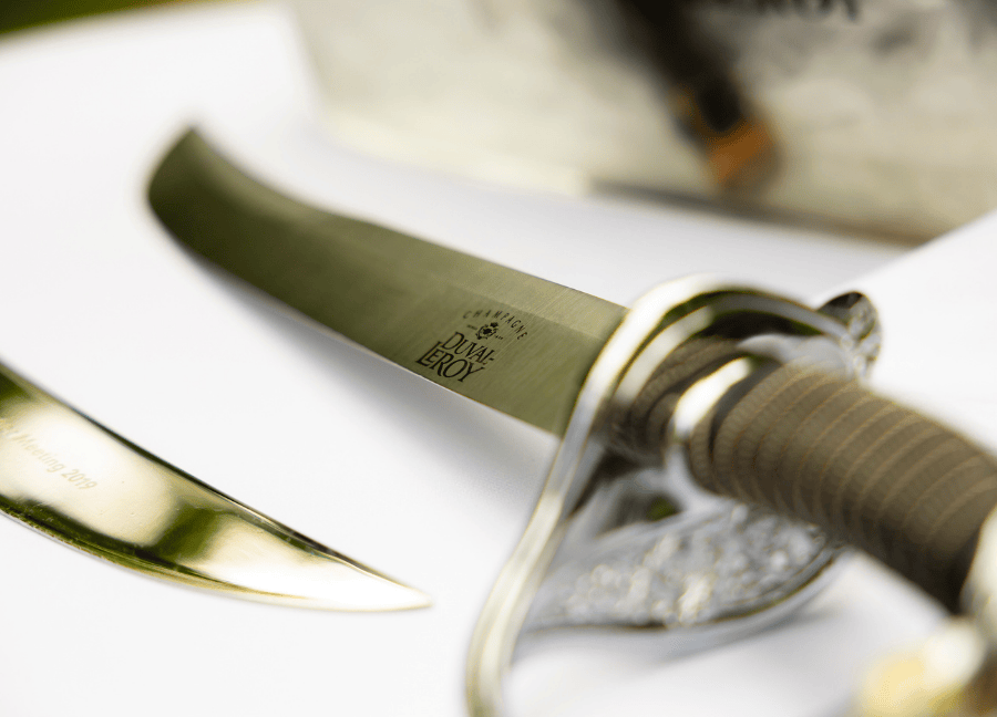 Duval-Leroy engraved champagne sabre.