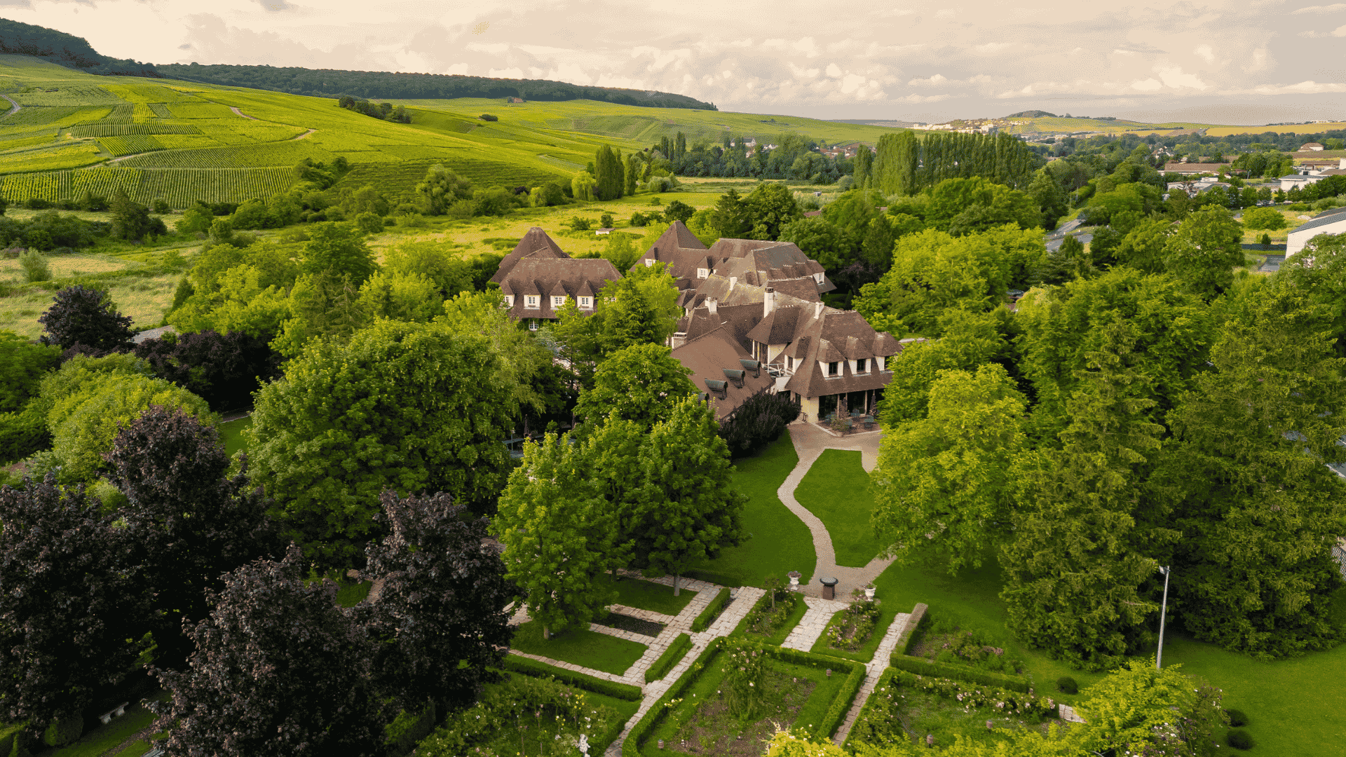 Hostellerie Briqueterie & Spa surrounded by gardens and vineyards near Épernay in Champagne.