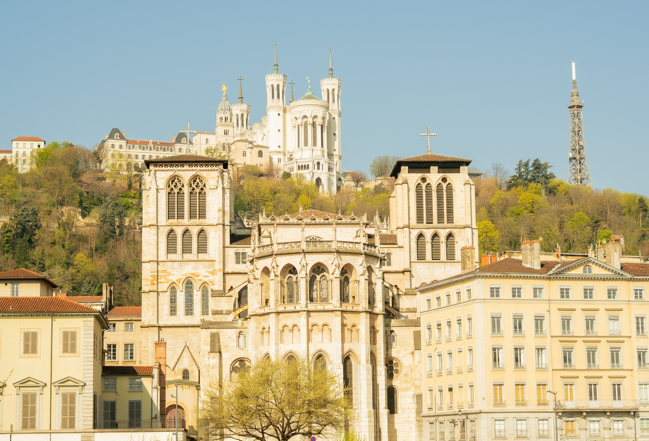 View of Saint-Jean Cathedral and Fourvière Basilica in Lyon, with the river in the foreground. Villa Florentine, Lyon river view.