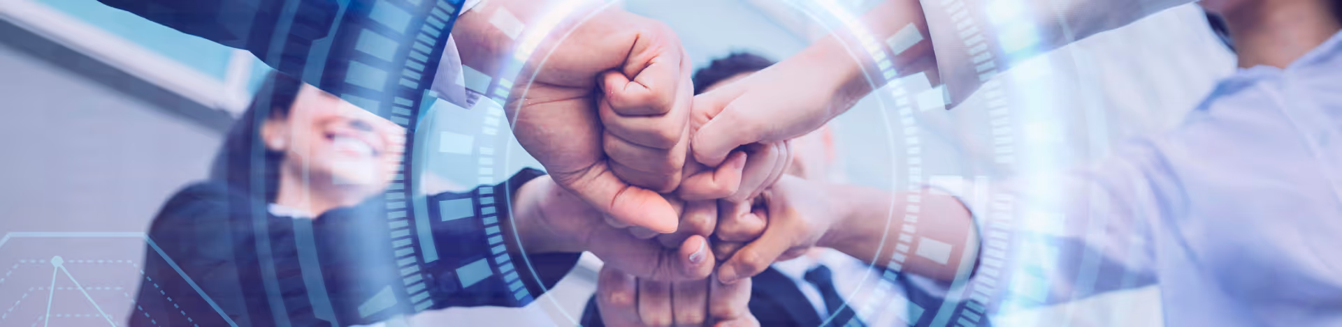 Close-up of a group of businesspeople fist bumping in a team gesture with digital overlay graphics.