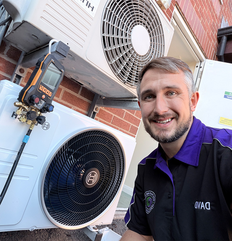 Dave in front of an air source heat pump installation