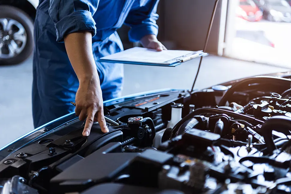 image of mechanics at work on a car